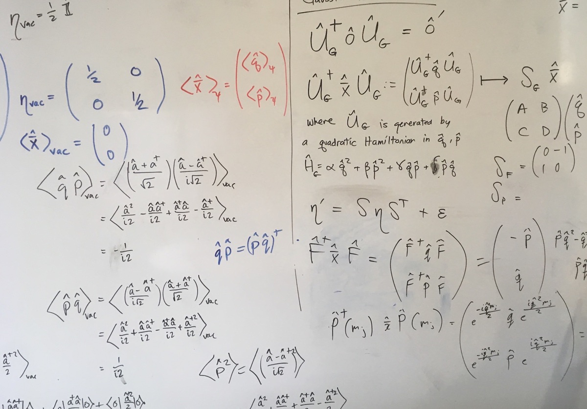 Handwritten equations on a whiteboard