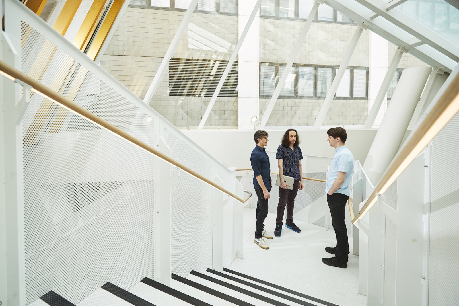 Researchers talking in the RMIT University building